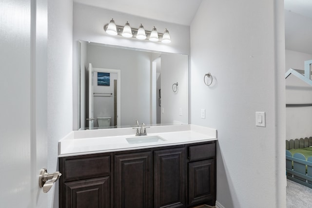 bathroom with toilet and vanity