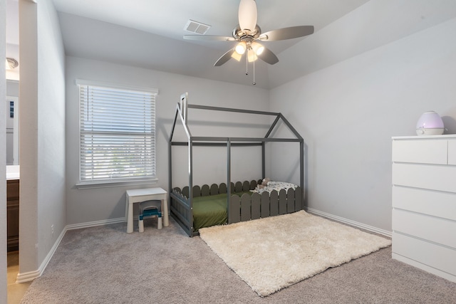 bedroom featuring light colored carpet and ceiling fan