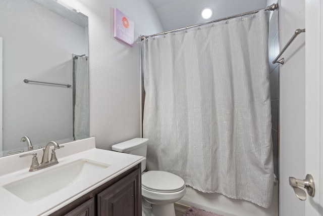 full bathroom with vanity, toilet, and shower / bath combination with curtain