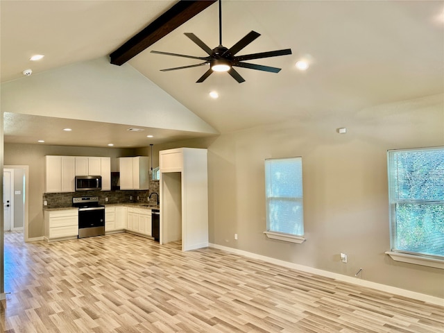 kitchen with white cabinetry, ceiling fan, stainless steel appliances, high vaulted ceiling, and beam ceiling