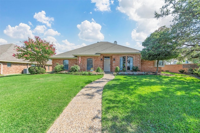 ranch-style home with a front lawn