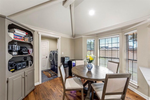 dining room featuring independent washer and dryer, lofted ceiling with beams, ornamental molding, and wood-type flooring