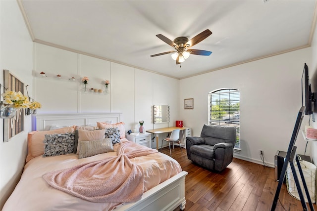 bedroom with dark hardwood / wood-style flooring, ceiling fan, and crown molding