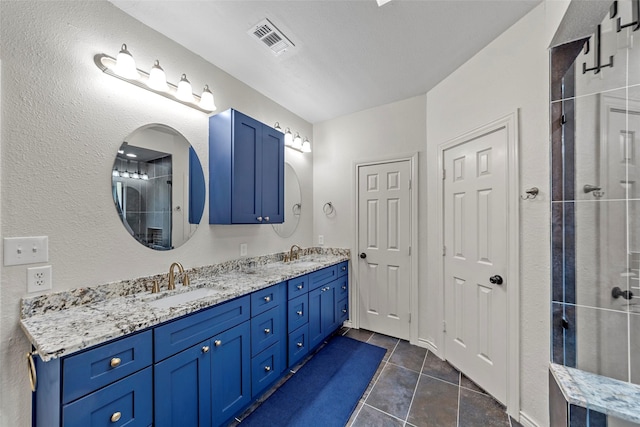 bathroom with tile patterned flooring and vanity