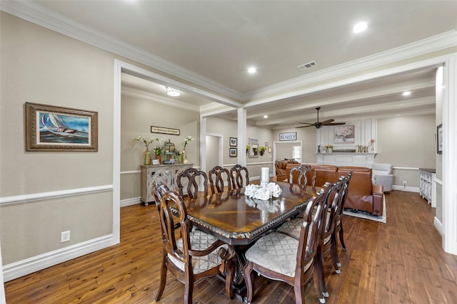 dining area with hardwood / wood-style floors, ceiling fan, and crown molding