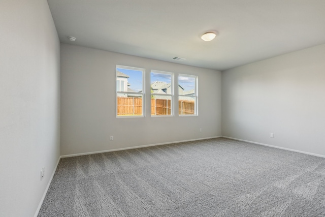 empty room featuring carpet floors