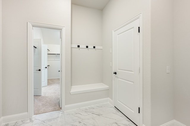 mudroom featuring light colored carpet