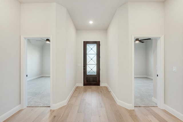 entryway with ceiling fan and light wood-type flooring