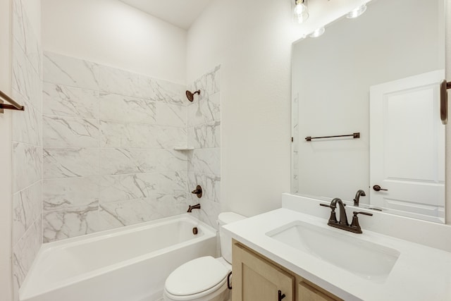 full bathroom featuring toilet, vanity, and tiled shower / bath