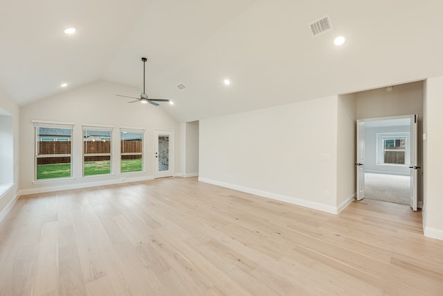 unfurnished living room with light wood-type flooring, vaulted ceiling, and ceiling fan