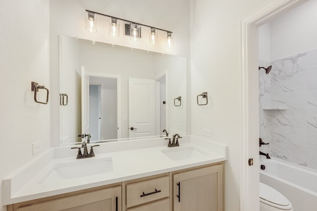 full bathroom featuring vanity, toilet, and tiled shower / bath combo