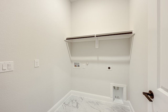 clothes washing area with hookup for a gas dryer, washer hookup, and hookup for an electric dryer