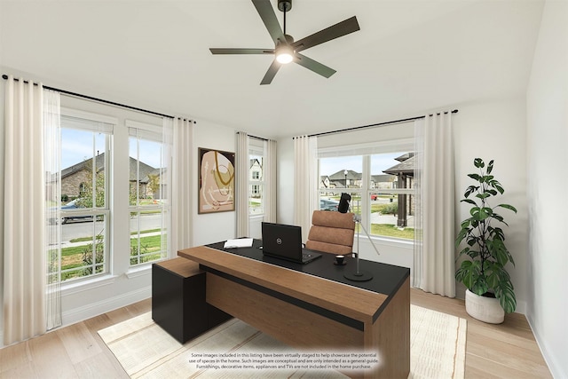 office area with ceiling fan, light hardwood / wood-style floors, and a wealth of natural light