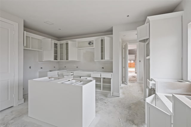 kitchen featuring a center island and white cabinetry