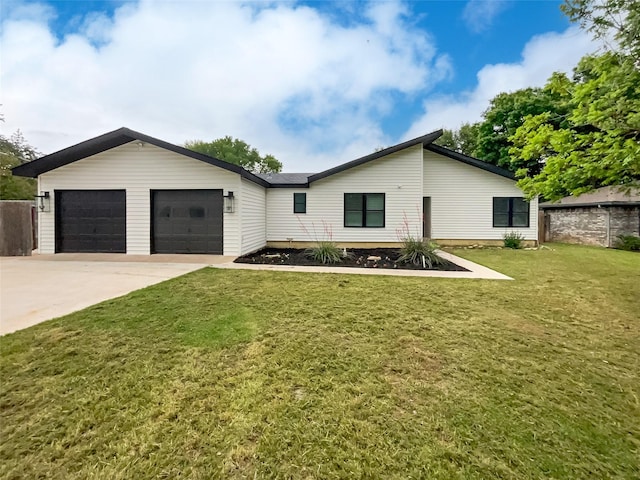 ranch-style home with a garage and a front lawn