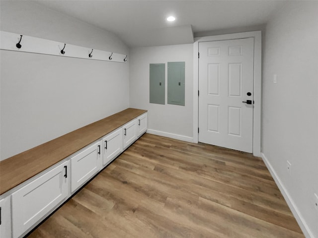 mudroom featuring light wood-type flooring and electric panel