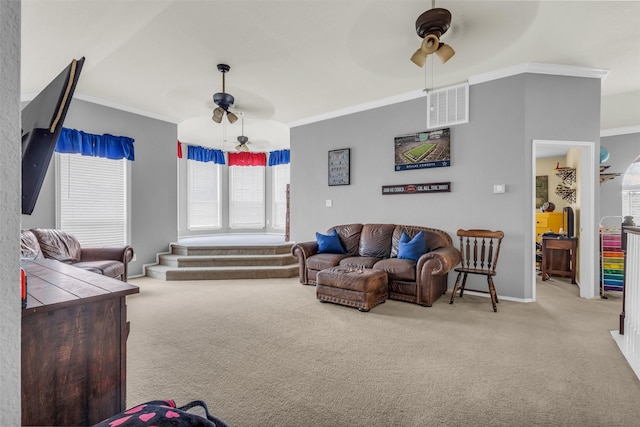 carpeted living room featuring ceiling fan and ornamental molding