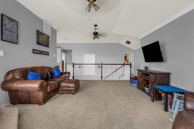 living room with ceiling fan, ornamental molding, light carpet, and vaulted ceiling