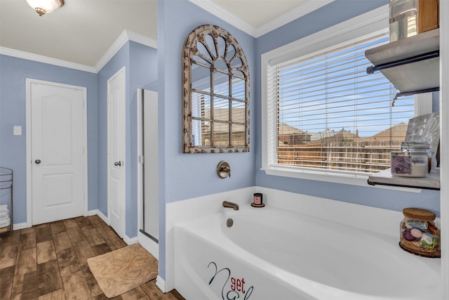 bathroom with hardwood / wood-style floors, ornamental molding, and shower with separate bathtub