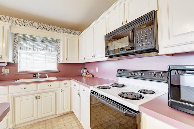 kitchen featuring sink and range with electric stovetop