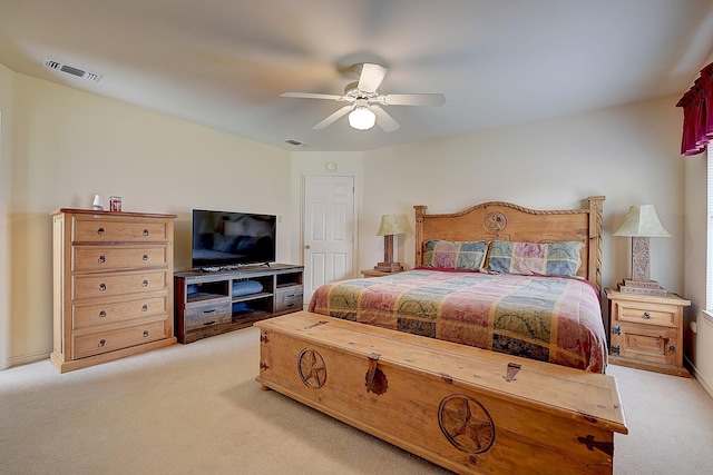 bedroom with light colored carpet and ceiling fan