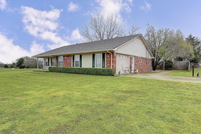 view of front of property with a garage and a front yard