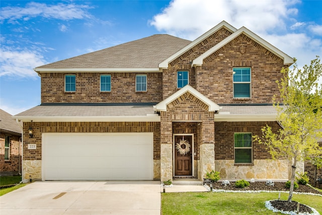 craftsman-style house with a garage and a front yard