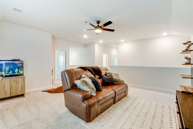 carpeted living room with ceiling fan