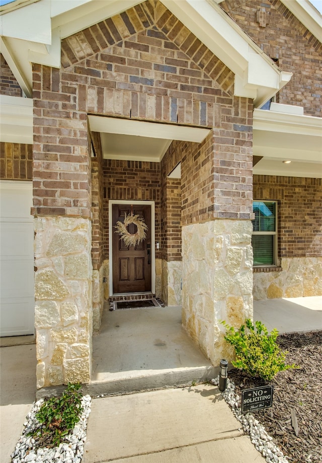 doorway to property featuring a garage