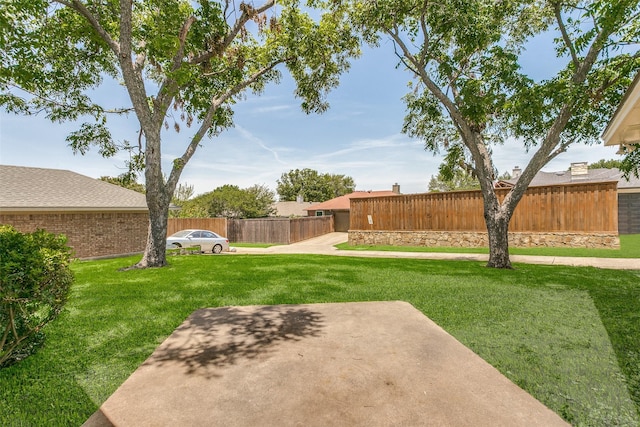 view of yard with a patio and fence