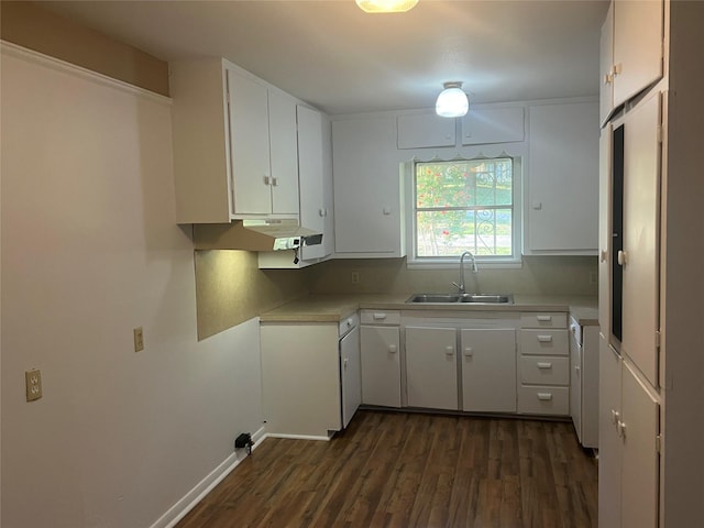 kitchen with dark hardwood / wood-style flooring, sink, and white cabinetry