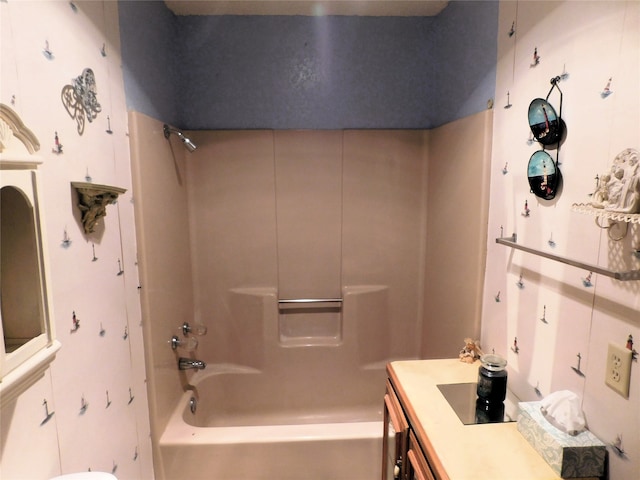 bathroom with vanity and shower / tub combination