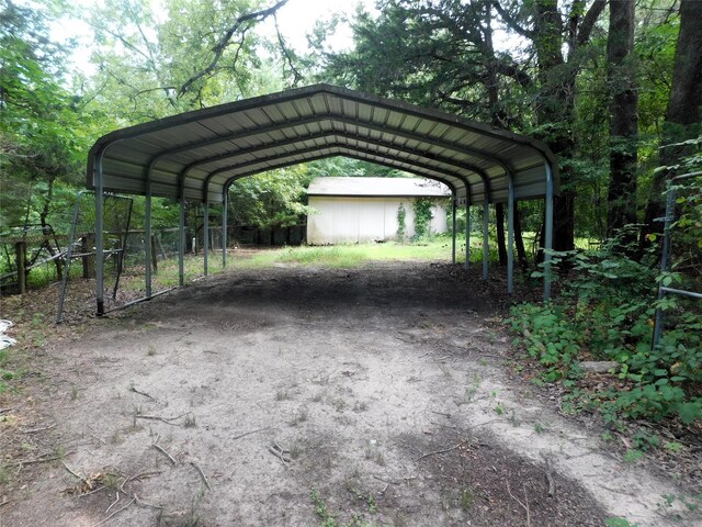 view of vehicle parking featuring a carport