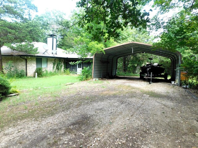 view of vehicle parking featuring a carport