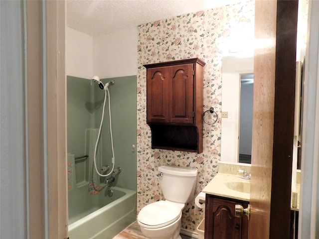 full bathroom featuring a textured ceiling, toilet, shower / bathing tub combination, vanity, and wood-type flooring