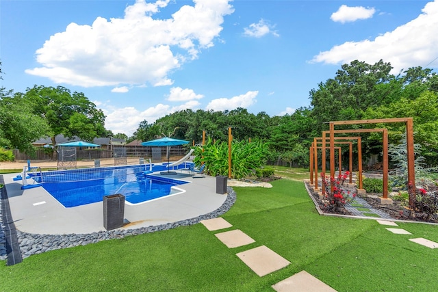 view of swimming pool with a patio area and a lawn