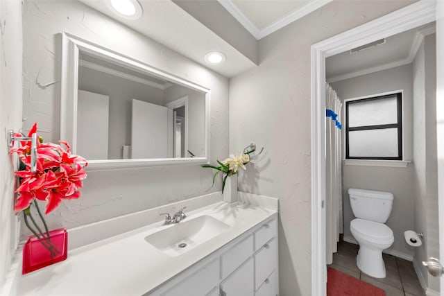 bathroom with tile patterned flooring, crown molding, vanity, and toilet