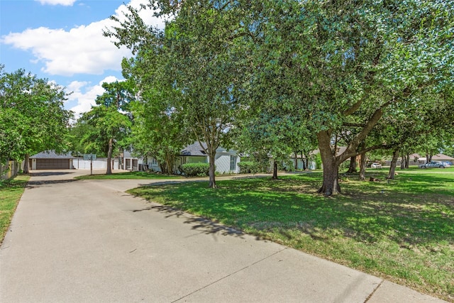 view of front of property with a garage and a front yard