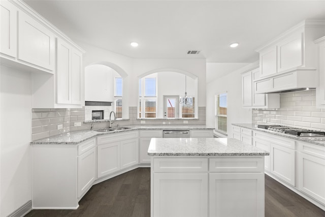 kitchen featuring white cabinetry, appliances with stainless steel finishes, dark hardwood / wood-style floors, and sink