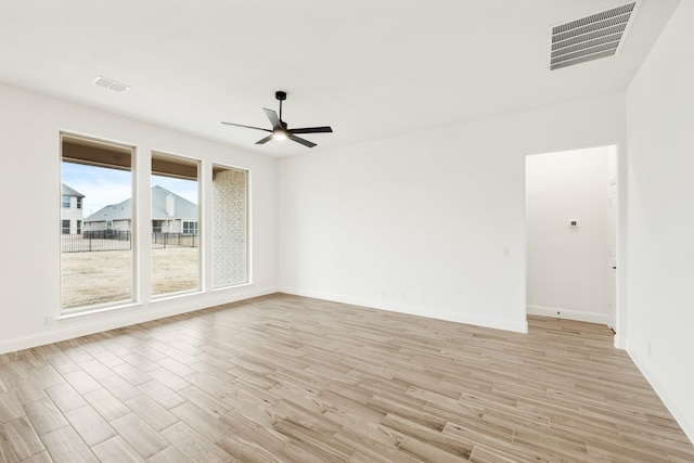 living room with ceiling fan and light hardwood / wood-style flooring