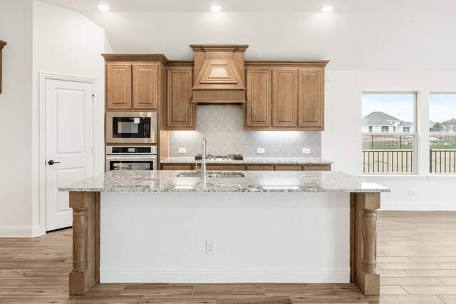 dining space with ceiling fan and sink