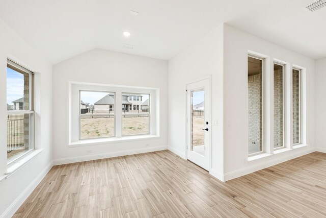 bedroom featuring lofted ceiling, light colored carpet, and ceiling fan