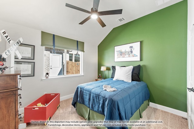 bedroom featuring vaulted ceiling, light colored carpet, and ceiling fan