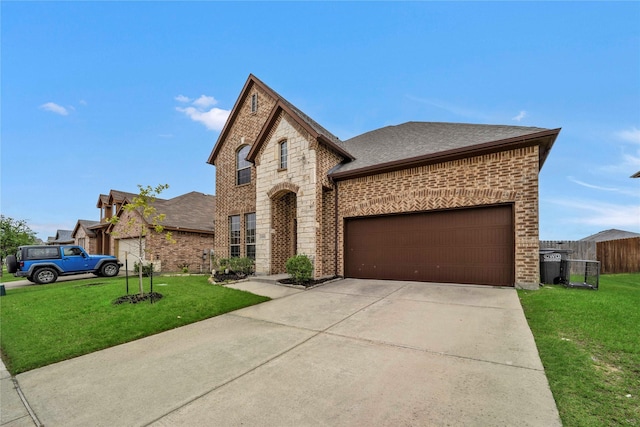 view of front facade with a garage and a front lawn