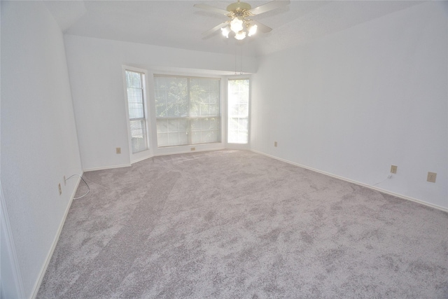 unfurnished room featuring ceiling fan and light colored carpet