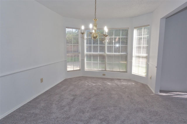 unfurnished dining area with a notable chandelier, carpet floors, and a healthy amount of sunlight