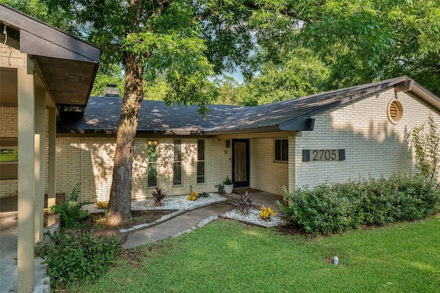 ranch-style home featuring a front yard