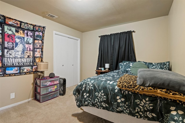 bedroom with carpet floors and a closet