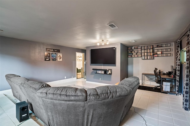 living room featuring light tile patterned floors and track lighting