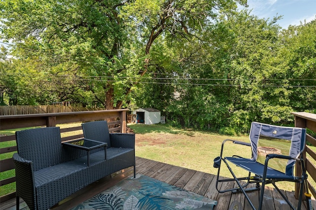 wooden deck with a shed and a lawn